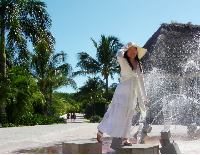 Beautiful Young Woman Walking Around Fountain of Youth Tropical Blue Bay Grand Esmeralda All Inclusive Playa Del Carmen Riviera Maya Mexico Vacation The fountain of youth