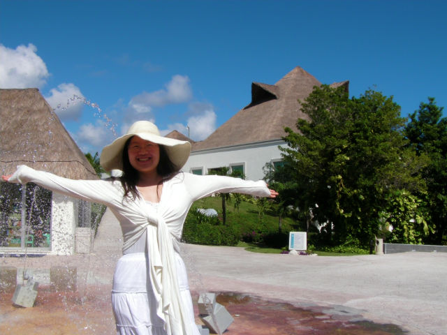 Beautiful Young Woman Welcome to Blue Bay Grand Esmeralda All-Inclusive Resort Playa Del Carmen Riviera Maya Mexico Vacation Tropical Paradise Welcome to Blue Bay Grand Esmeralda All-Inclusive Resort!